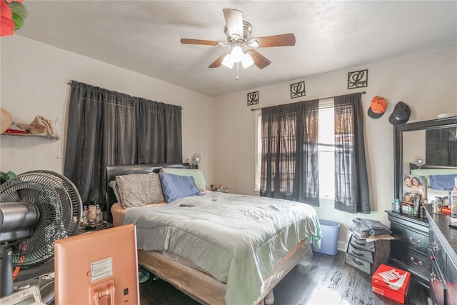 bedroom featuring ceiling fan and dark wood-type flooring