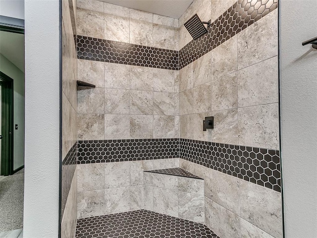 bathroom featuring tiled shower