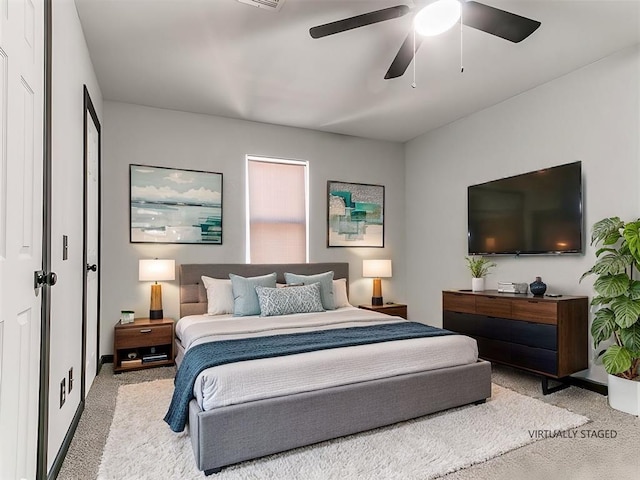 carpeted bedroom featuring ceiling fan