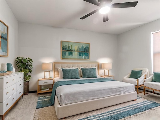 bedroom with light colored carpet and ceiling fan