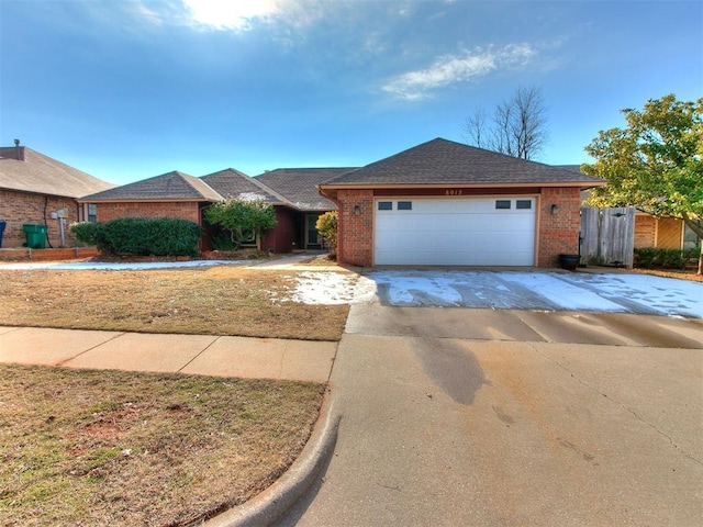 ranch-style house featuring a garage