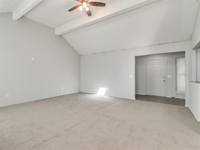 carpeted spare room with lofted ceiling with beams and ceiling fan