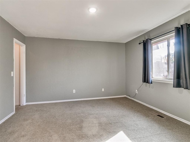 unfurnished room with carpet floors