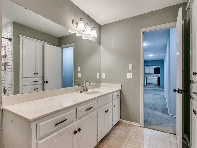 bathroom with tile patterned flooring and vanity