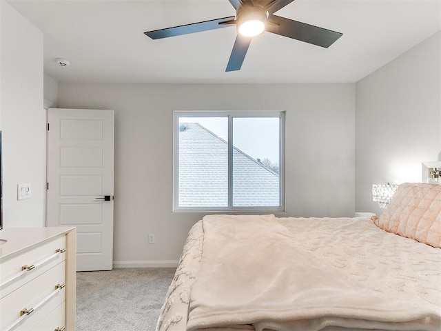 bedroom with light carpet and ceiling fan