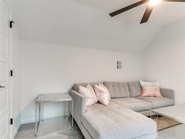 living room with ceiling fan, lofted ceiling, and carpet floors