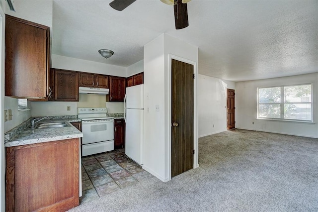 kitchen with ceiling fan, light colored carpet, white appliances, and sink