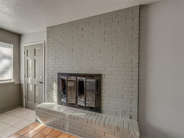 details featuring a fireplace and a textured ceiling