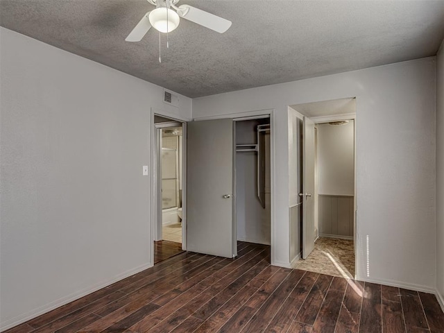 unfurnished bedroom featuring a textured ceiling, a closet, and ceiling fan