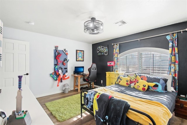 bedroom featuring dark hardwood / wood-style flooring