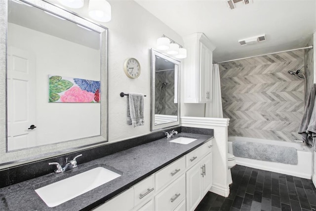 full bathroom with vanity, shower / bath combination with curtain, and toilet