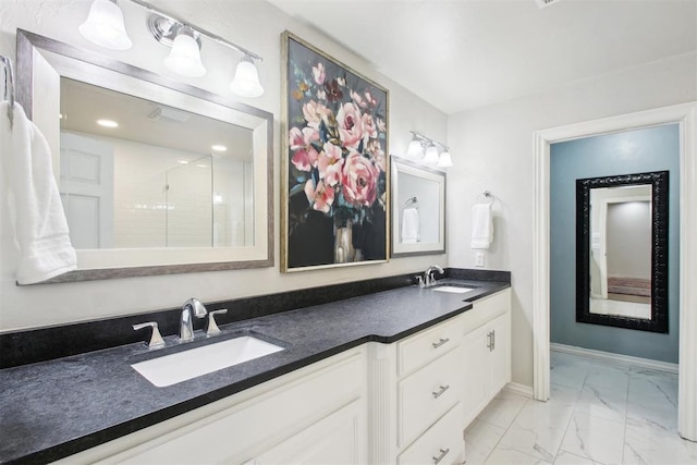 bathroom featuring vanity and a shower with shower door