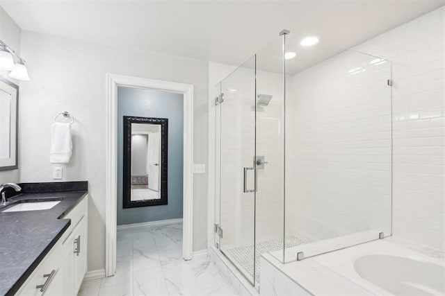 bathroom with vanity and separate shower and tub