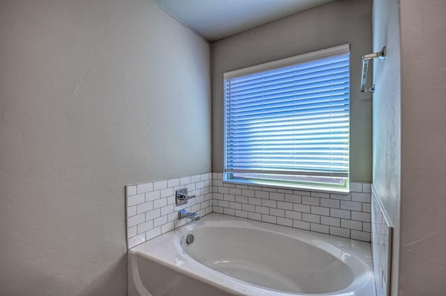 bathroom featuring a bath