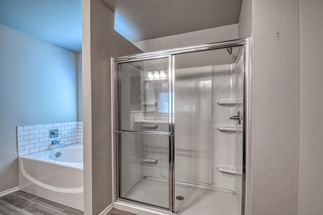 bathroom with separate shower and tub