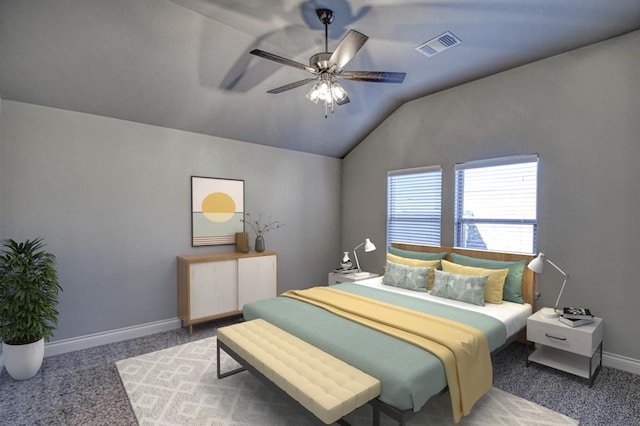 carpeted bedroom with ceiling fan and vaulted ceiling