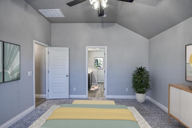 exercise area featuring ceiling fan, carpet floors, and vaulted ceiling