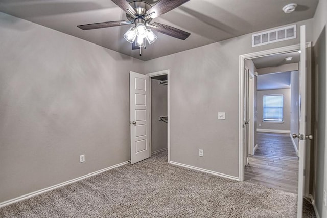 unfurnished bedroom featuring carpet flooring and ceiling fan