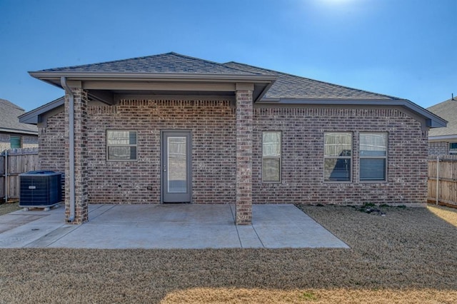 back of house with central AC unit and a patio area