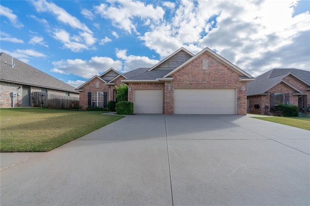 view of front of property featuring a front lawn and a garage