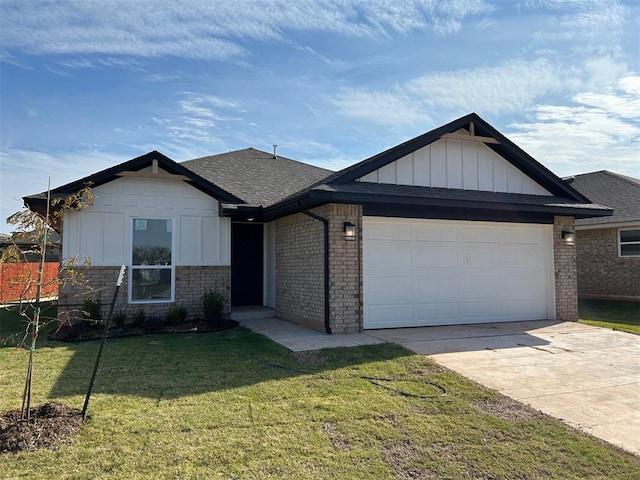 view of front facade with a front yard and a garage