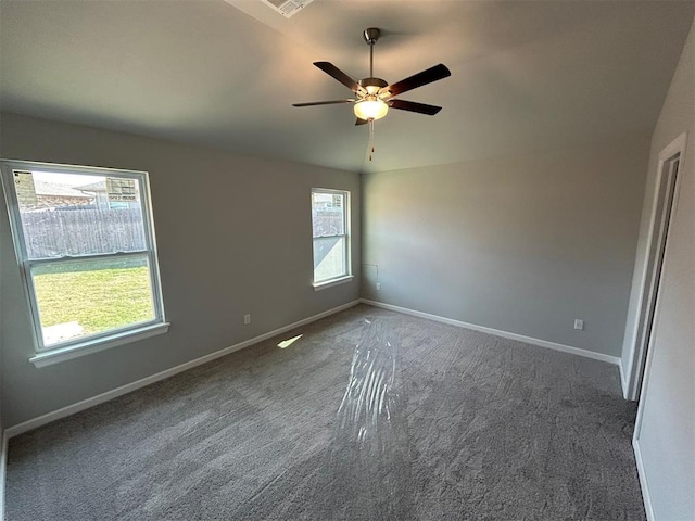 carpeted empty room featuring ceiling fan