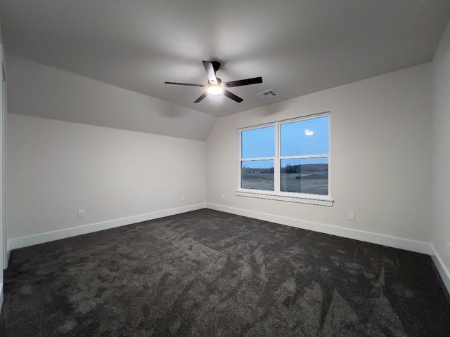 bonus room with baseboards, visible vents, vaulted ceiling, and a ceiling fan