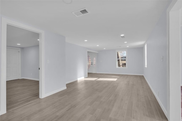 unfurnished room featuring light wood-type flooring