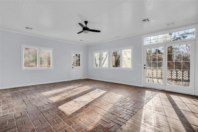 spare room featuring ceiling fan and crown molding