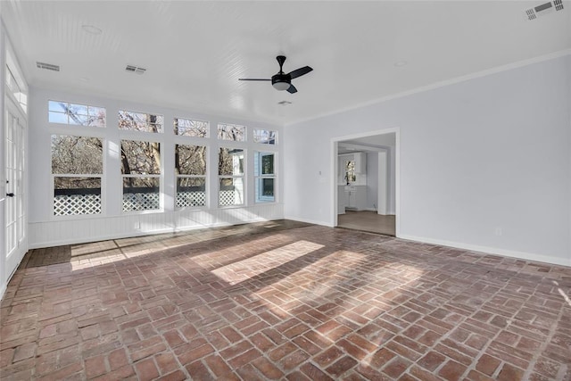 interior space featuring ceiling fan and crown molding