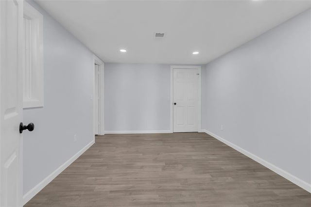 spare room featuring light wood-type flooring