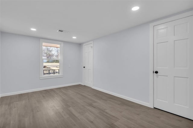 spare room with light hardwood / wood-style flooring