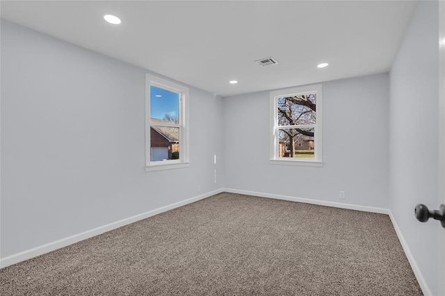 unfurnished room with carpet flooring