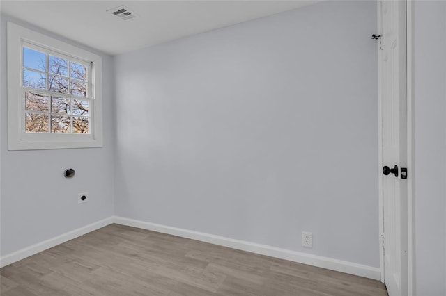 unfurnished room with light wood-type flooring