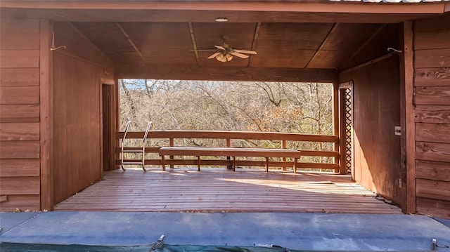 wooden deck featuring ceiling fan