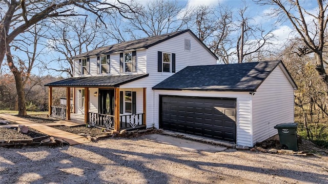 view of front of property featuring a porch and a garage