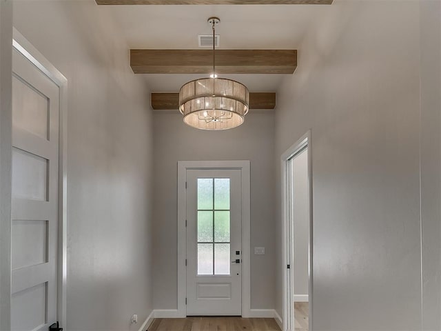 2408 Lazio Way, Edmond, OK 73034 - doorway to outside with beam ceiling, a chandelier, and light wood finished floors