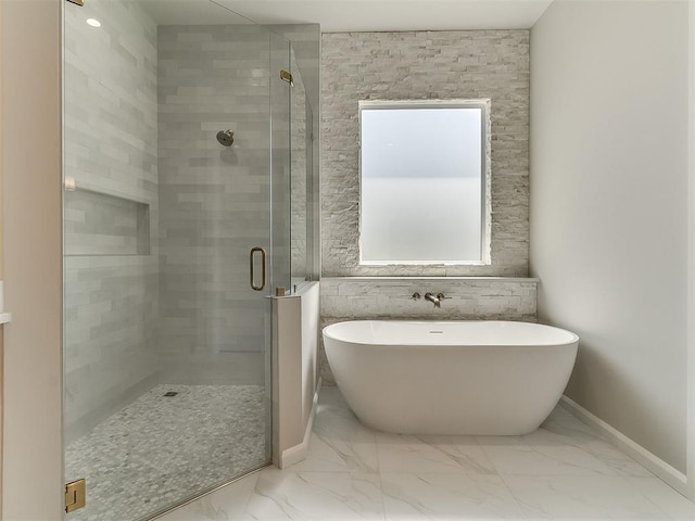 2408 Lazio Way, Edmond, OK 73034 - bathroom featuring a stall shower, marble finish floors, and a freestanding bath