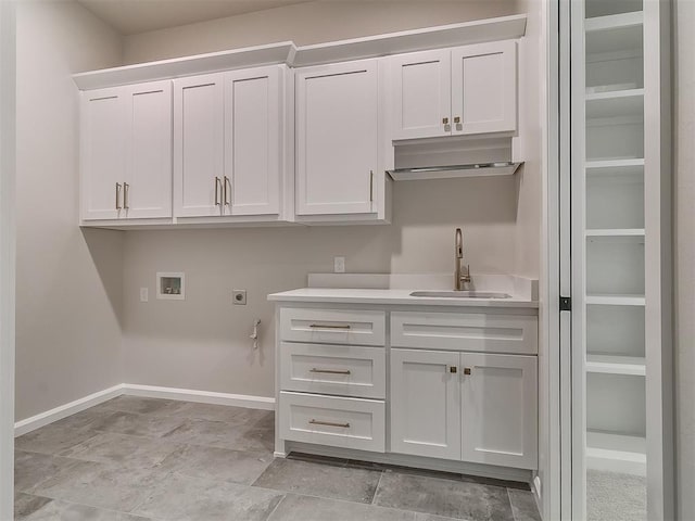 2408 Lazio Way, Edmond, OK 73034 - laundry area with electric dryer hookup, hookup for a washing machine, cabinet space, and bar with sink