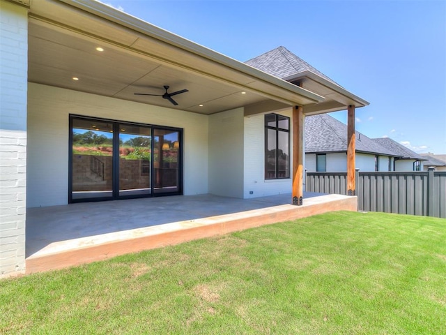 2408 Lazio Way, Edmond, OK 73034 - back of house with a patio area, a ceiling fan, brick siding, and roof with shingles
