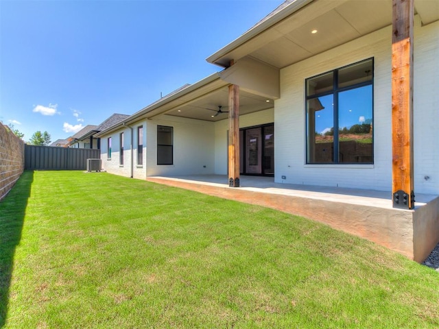 2408 Lazio Way, Edmond, OK 73034 - rear view of house featuring brick siding, a patio, and ceiling fan