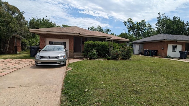 single story home featuring an attached garage, concrete driveway, brick siding, and a front yard