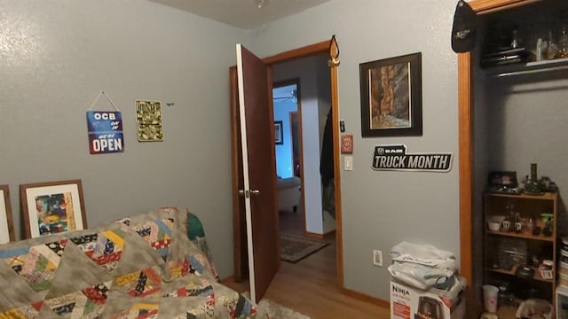 bedroom with wood finished floors