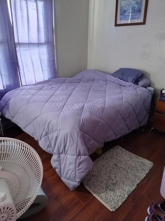 bedroom featuring wood finished floors