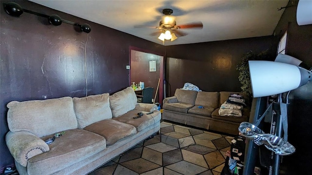 living area featuring a ceiling fan