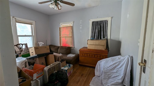 interior space with ceiling fan and wood finished floors