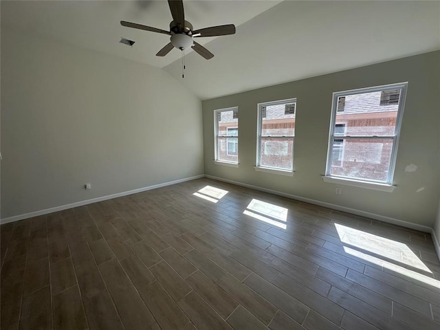 unfurnished room with dark wood finished floors, lofted ceiling, visible vents, a ceiling fan, and baseboards