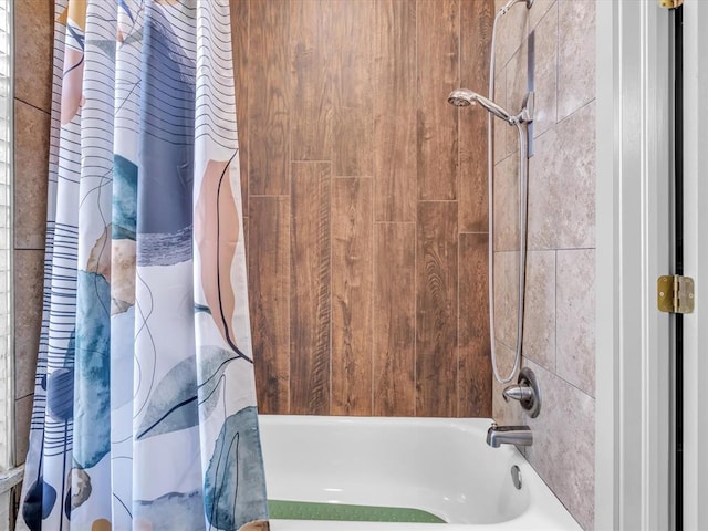 bathroom featuring shower / bathtub combination with curtain