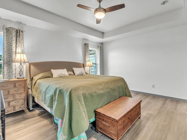 bedroom featuring ceiling fan and hardwood / wood-style floors