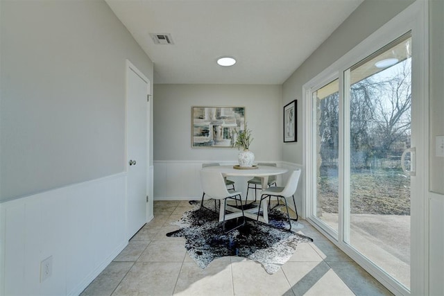 dining area with light tile patterned floors